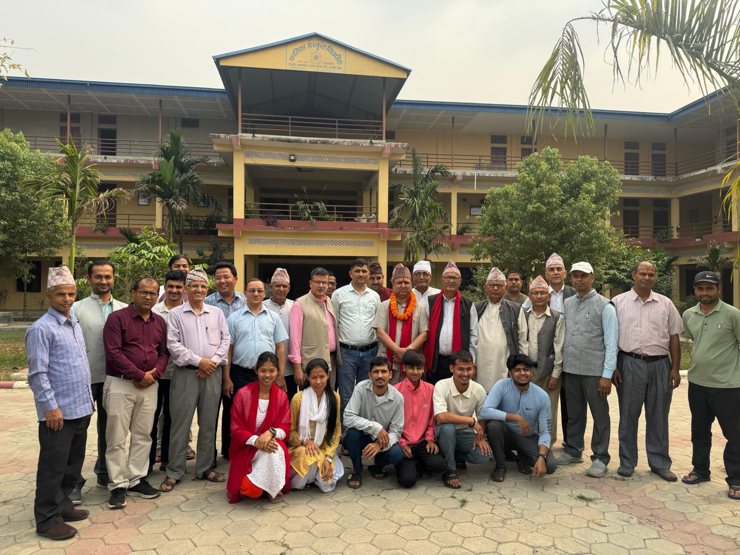 Guests and faculty outside the campus building